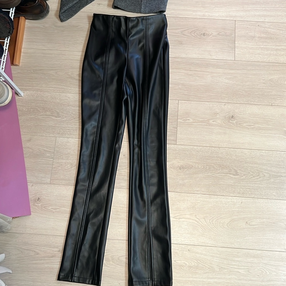 Vero Moda faux leather pants / leggings .  Front slit on bottom of pants